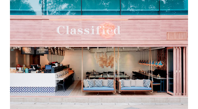 Classified Hong Kong is more than a dining experience; it's an architectural masterpiece that engages all the senses. Our inspiration drew from the café's coastal surroundings, translating into an architectural marvel that embraces marine-blue tiles, rustic timber flooring, and bespoke lobster-pot-inspired ceiling lights. Design by Studio Königshausen.